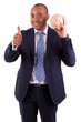 Photo: African American business man holding a piggy bank making thumbs African American business man holding a piggy bank making thumbs