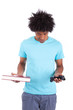 Young black teenage men holding a book and a video game controll