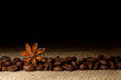 Coffee and Star Anise on sackcloth background with copyspace