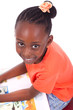 Cute black african american little girl reading a book - African