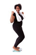 Foto: African American woman cheering on scale - African people African American woman cheering on scale - African people
