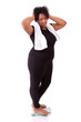 Disappointed African American woman using a scale  - African peo