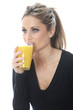 Model Released. Young Woman Drinking Orange Juice
