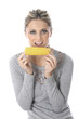Model Released. Young Woman Eating Corn on the Cob