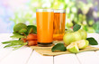 Glasses of juice, apples and carrots