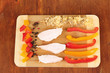 Preparing chicken stir fry with vegetables and spices