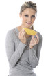 Model Released. Young Woman Eating Corn on the Cob