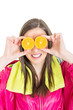 Colorful and fun fitness girl with oranges over her eyes