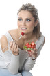 Model Released. Young Woman Eating Fresh Fruit Salad