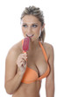 Model Released. Young Woman Eating Ice Lolly