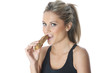 Foto: Model Released. Young Woman Eating Energy Cereal Bar Model Released. Young Woman Eating Energy Cereal Bar