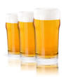 Frosty glass of light beer set isolated