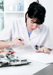 Electronics repair worker reading