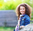 Foto: Portrait of the smiling little girl outdoor Portrait of the smiling little girl outdoor