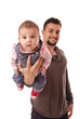 father holds the baby's chest.