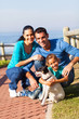 Photo: family at the beach with pet dog family at the beach with pet dog