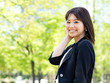 beautiful asian businesswoman in the park