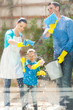 Photo: happy family cleaning home window happy family cleaning home window