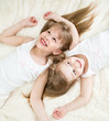 Photo: happy kids lying on back in pajamas top view happy kids lying on back in pajamas top view