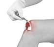 Hand disinfecting wound on hand knee.