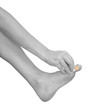 Hand putting Adhesive Bandage on finger isolated on white