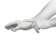 Hand putting Adhesive Bandage isolated on white