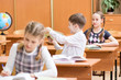 Photo: school children at lesson in classroom school children at lesson in classroom