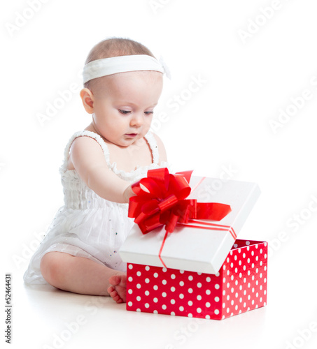 Photo: baby girl opening gift box baby girl opening gift box