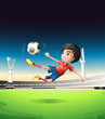 A boy in a red uniform at the soccer field