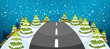 A hill covered with snow with a narrow road