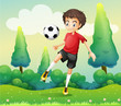 A boy with a red shirt kicking a soccer ball