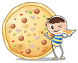 A boy beside a big pizza