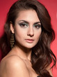 Beautiful passionate brunette woman on red