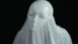 A man in scary mask and sheet, over dark background