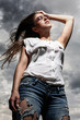 Photo: Beautiful woman over sky background Beautiful woman over sky background