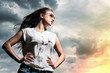 Photo: Beautiful woman over sky background Beautiful woman over sky background