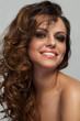 Beautiful woman with curls and makeup