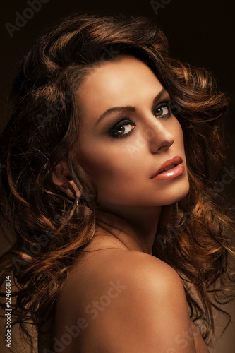 Photo: Beautiful woman with curls and makeup Beautiful woman with curls and makeup