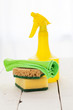 Bright colorful cleaning set on a wooden table