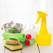 Bright colorful cleaning set on a wooden table