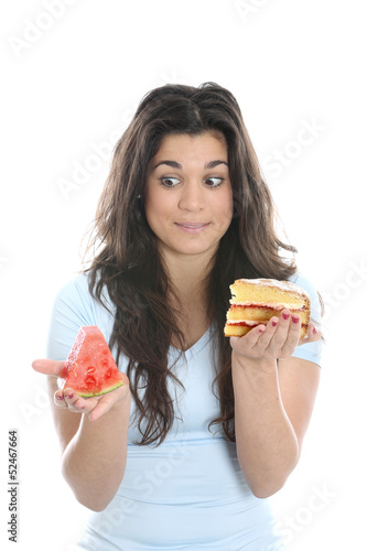 Photo: Model Released. Young Woman Holding Melon and Cake Model Released. Young Woman Holding Melon and Cake