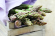 Fresh green asparagus stalks in a crate