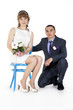 Portrait of Caucasian groom and Asian bride.