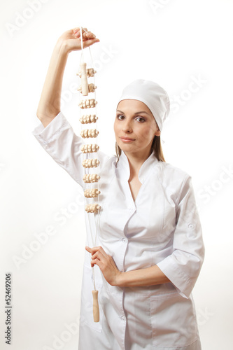 Photo: Doctor with wooden massage tool , isolated on white background Doctor with wooden massage tool , isolated on white background