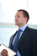 Portrait of businessman working on electronic tablet