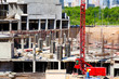 Construction. Red construction crane in the foreground.