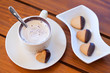 Chocolate dipped heart shaped shortbread cookies and a cup of ca