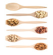 Wooden spoons full of different nuts