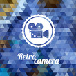 Retro camera on color background made of triangles