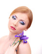 Photo: Beautiful young woman with glamour make up and flower, isolated Beautiful young woman with glamour make up and flower, isolated
